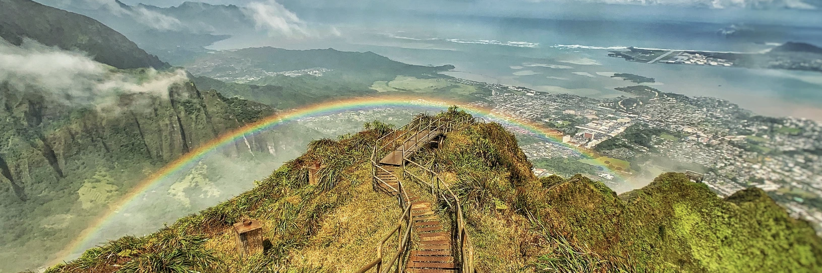 A rainbow over the Haiku Stairs on Oahu, Hawaii. 