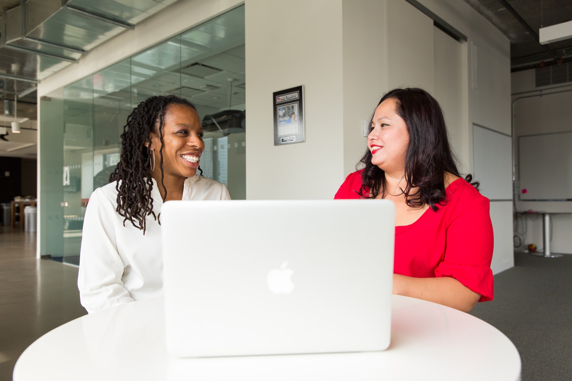 Two women looking at a computer screen