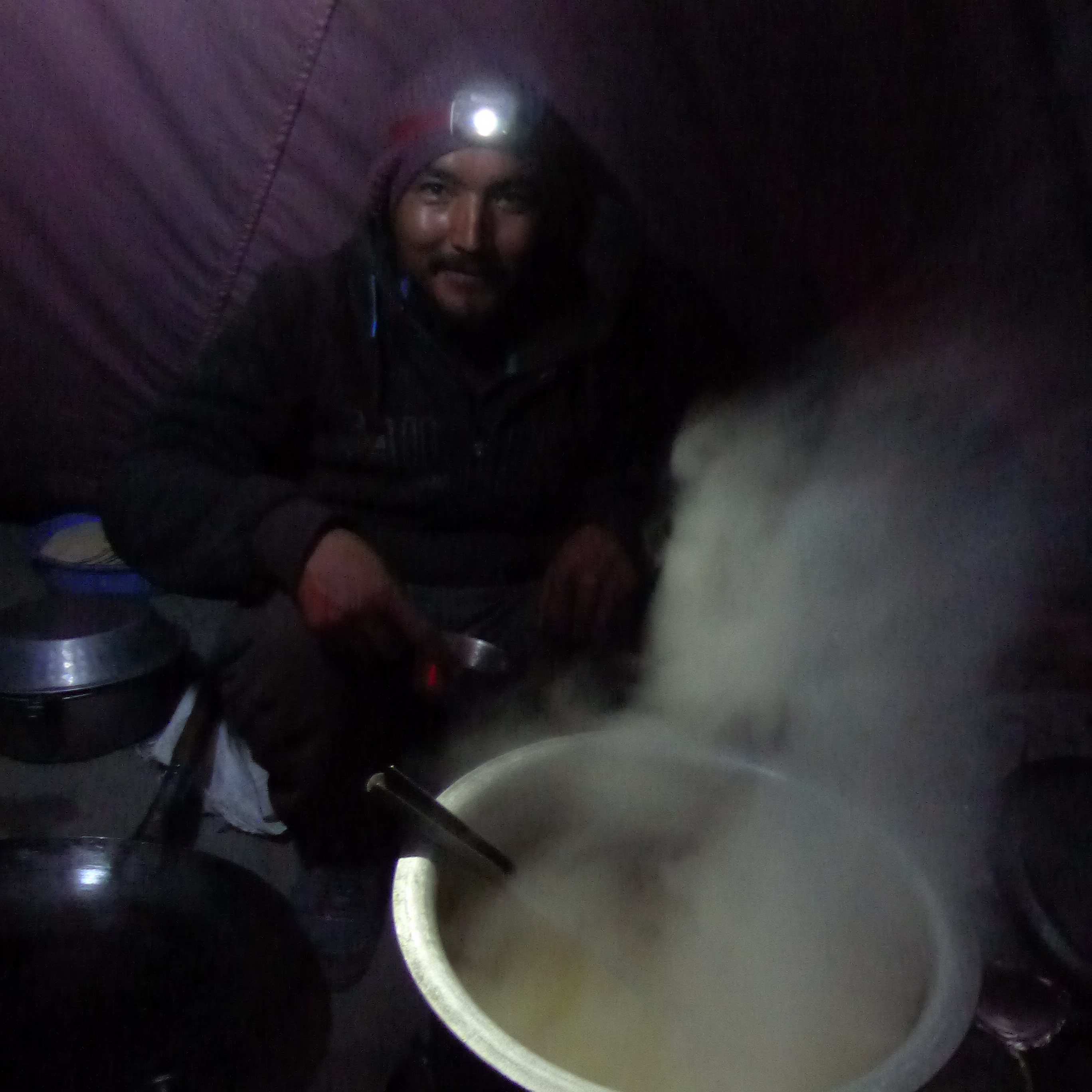 Our head chef Lobzang cooking with a headlamp