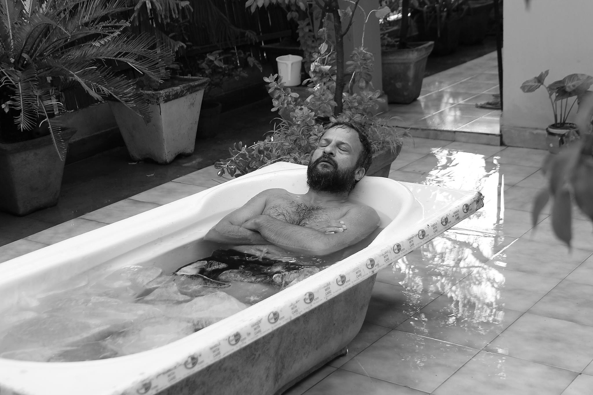 Mohit in a tub of cold water with ice slabs in New Delhi in June. The temperature outside was 45C