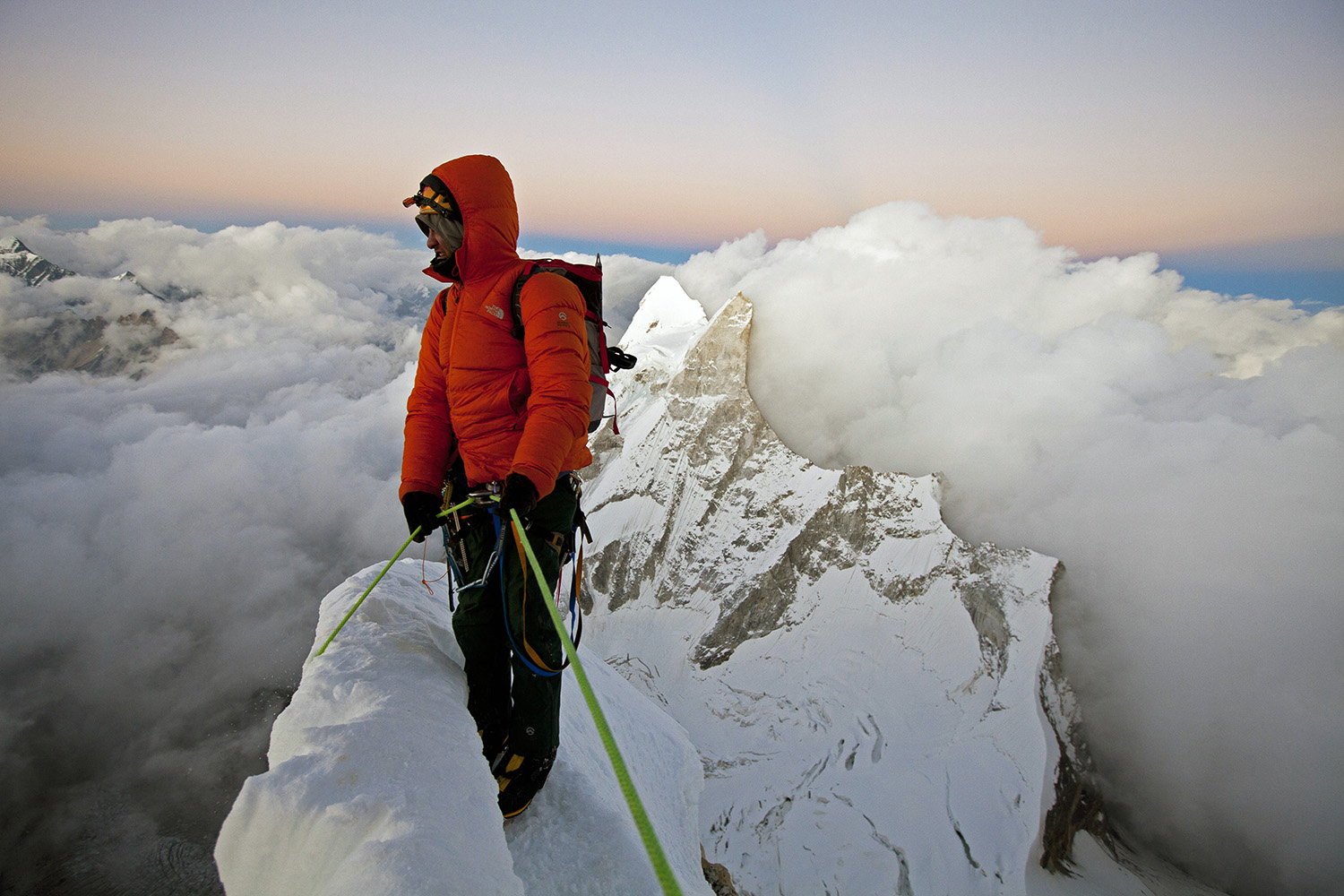 Exhausted, Renan Ozturk contemplates the long descent after making the summit.