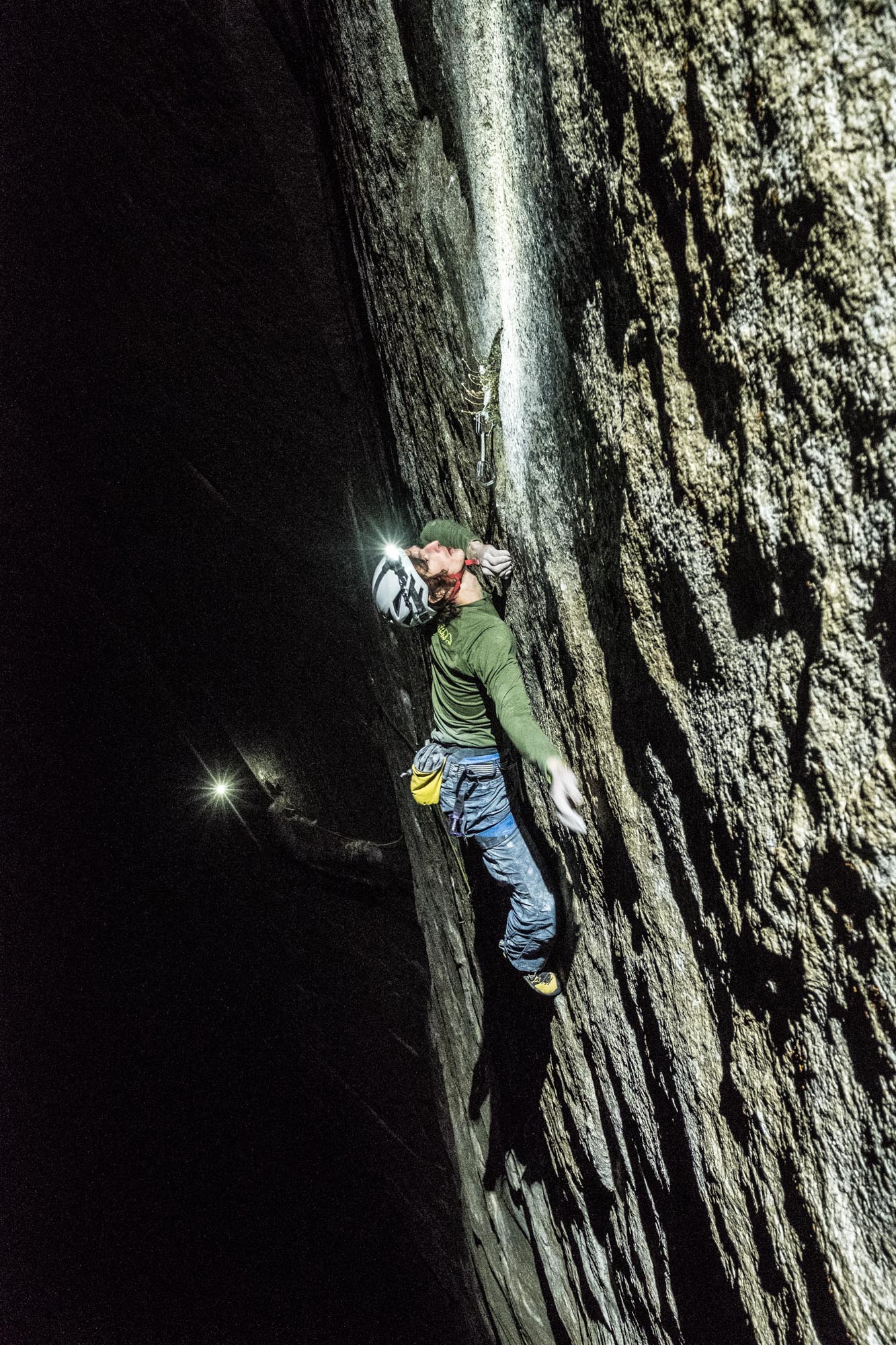 Adam Ondra climbing pitch 21 of the Dawn Wall by headlamp. Photo Courtesy Heinz Zak/ Black Diamond Equipment 