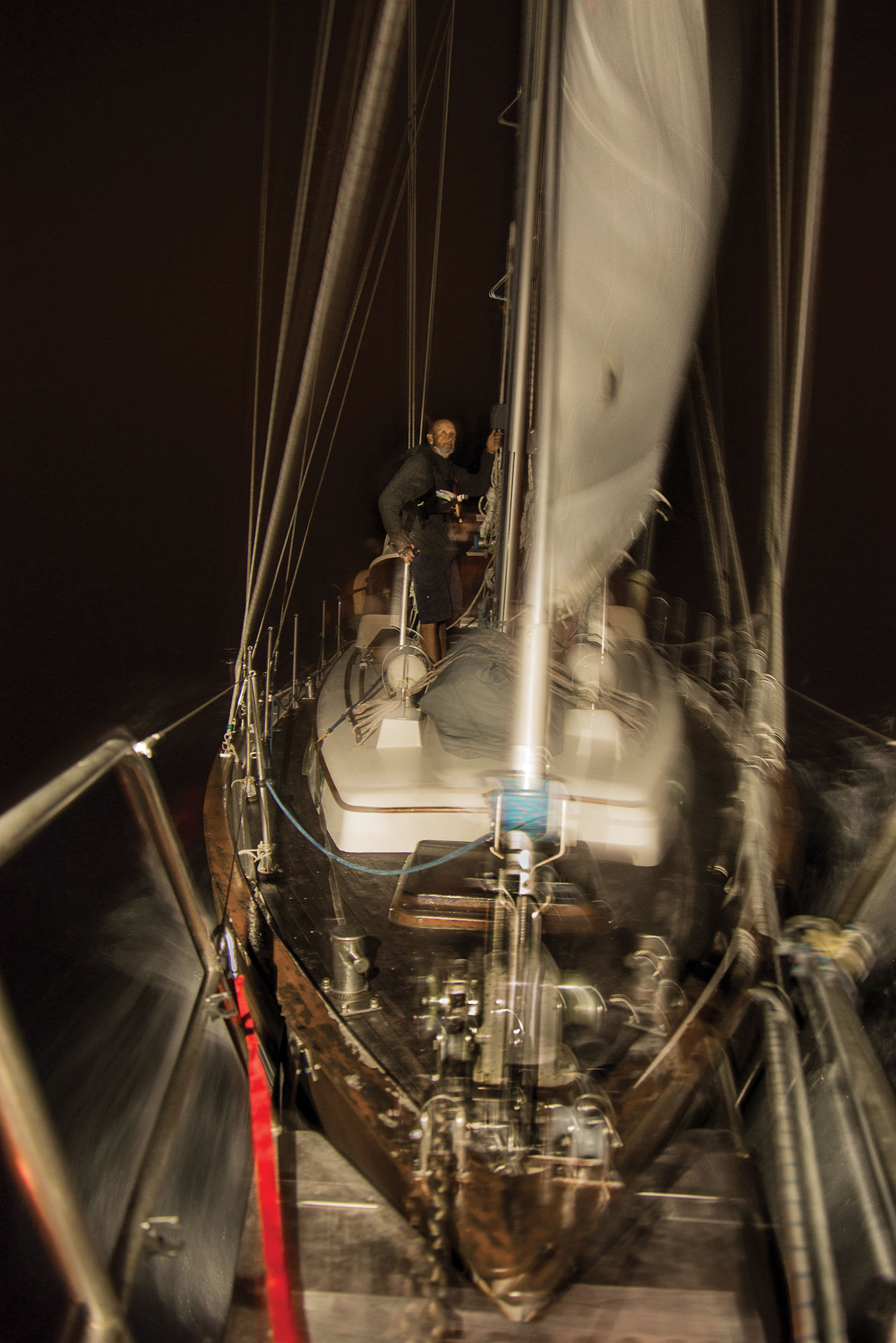 Chris adjusts lines on the bow of Anna Rose in the middle of the night during our seven-day crossing from the Solomon Islands to Vanuatu.