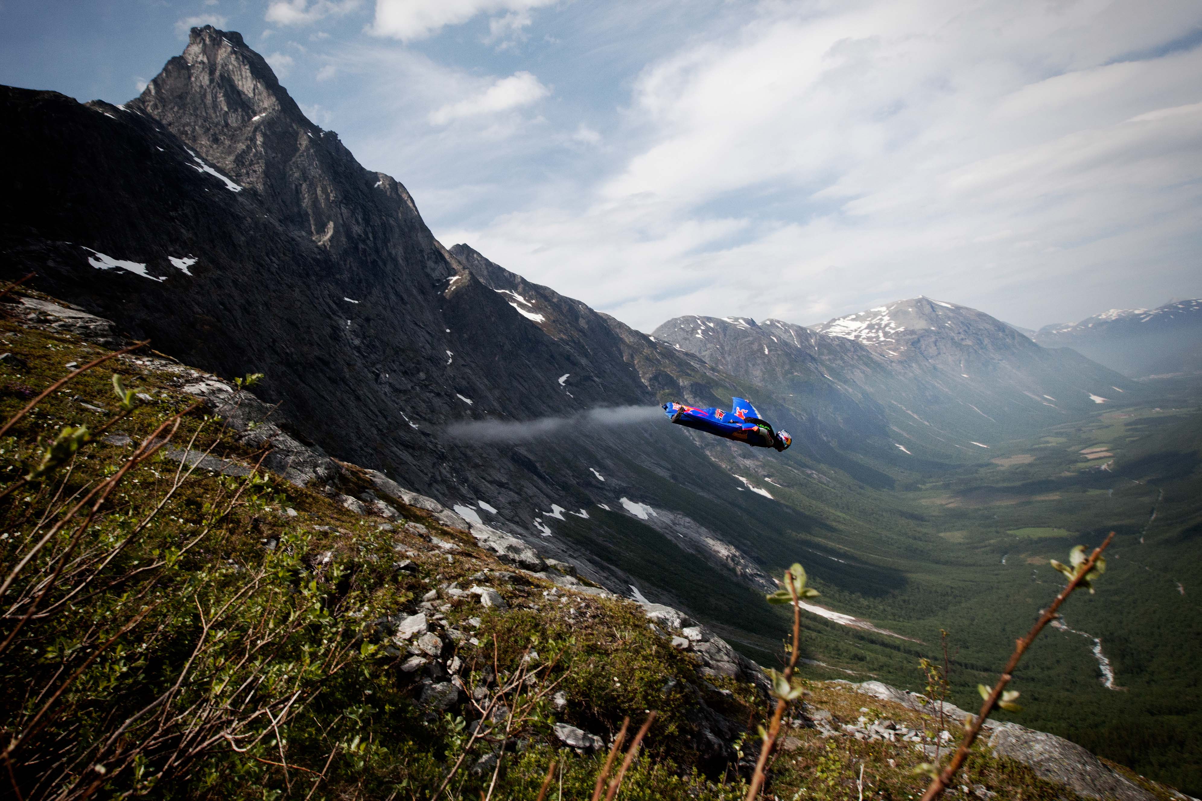 The usual, attainable glide ratio of a wingsuit is 2:5:1. For every meter dropped, two and a half meters are gained flying forward. Pictured here, an afternoon flight down Jokke's local spot in Bispen, Norway. Photo: Trond Teigen 