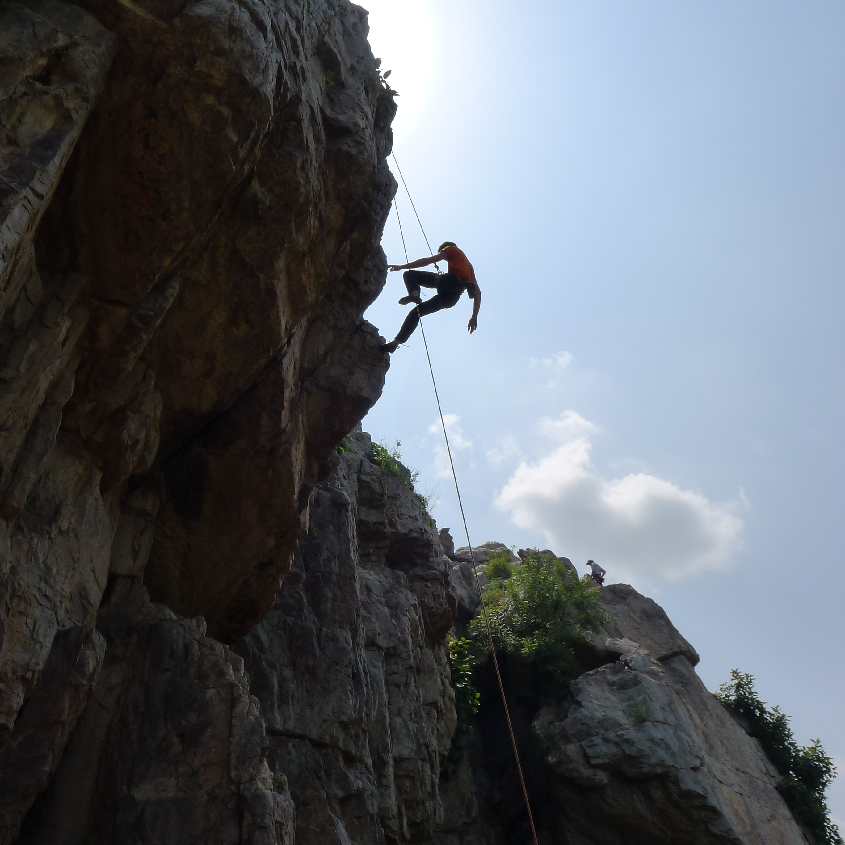 Being lowered down the overhang in the Prow area. At 40 feet (12 meters), the route, aptly called "Beasterly" is rated three-starred 5.9R. Members of "Delhi Rock" started climbing about five years ago, and have started again in earnest since last fall.