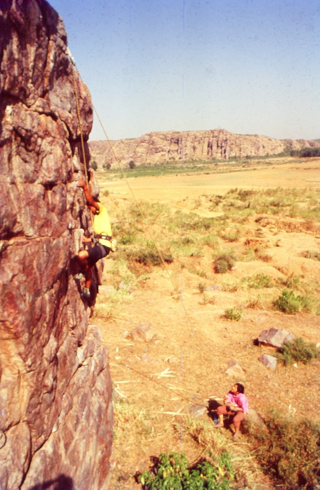 Annie Jacob climbing "Short Haired Civilian", a 5.10c R and 30 feet high route in the Pantheon Rocks area. Image © Raghav Sundar