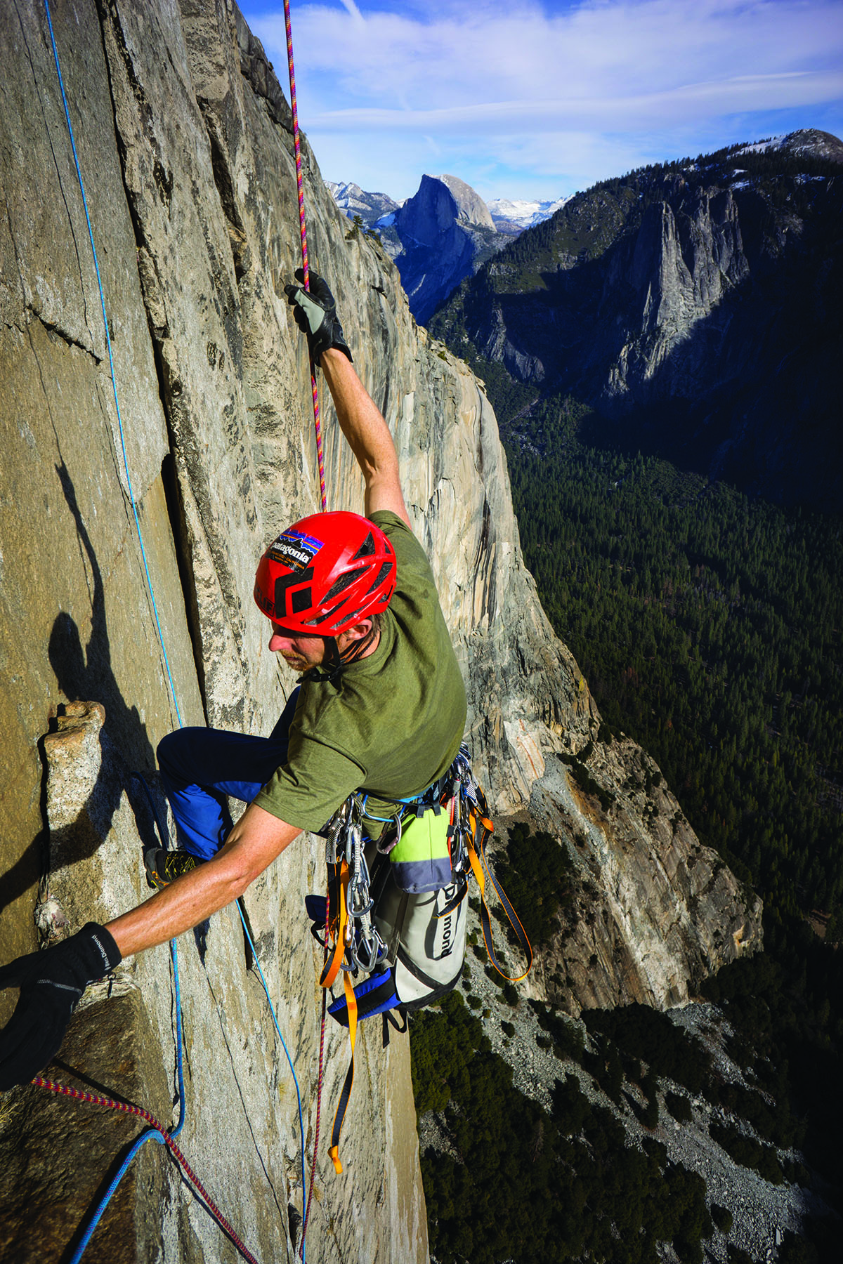 Tommy reaches for a rope on the wall.