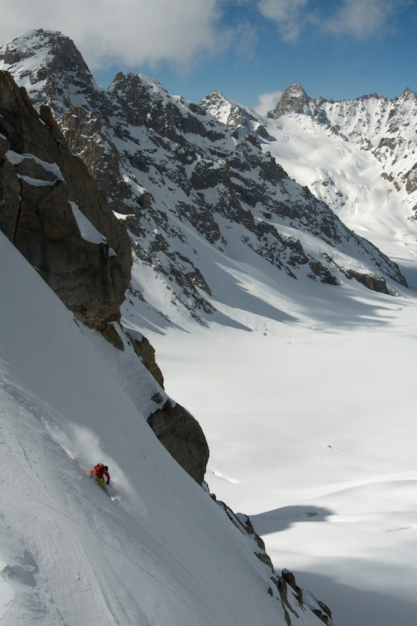 Hiaree O'Neill drops into perfect powder near 19,000 feet on an unknown flank high above the Tos Glacier.