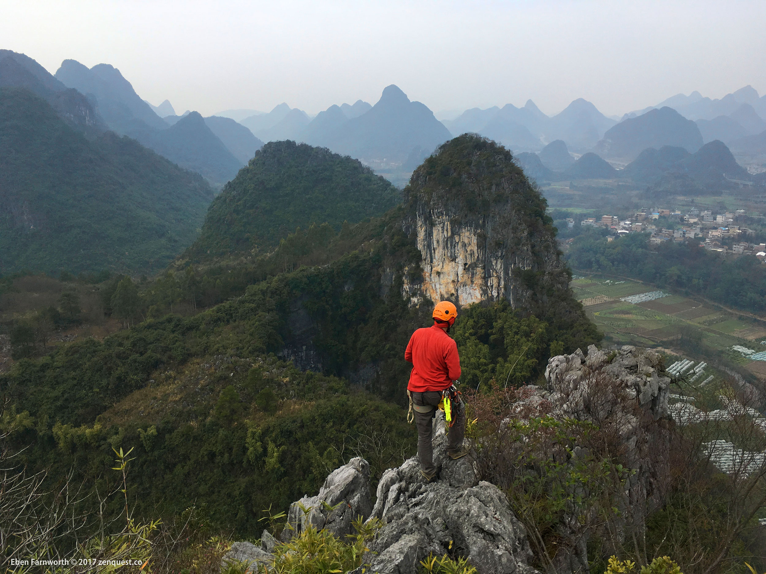 Looking out at the rolling karst landscape of Guangxi China from on top of the mountain.