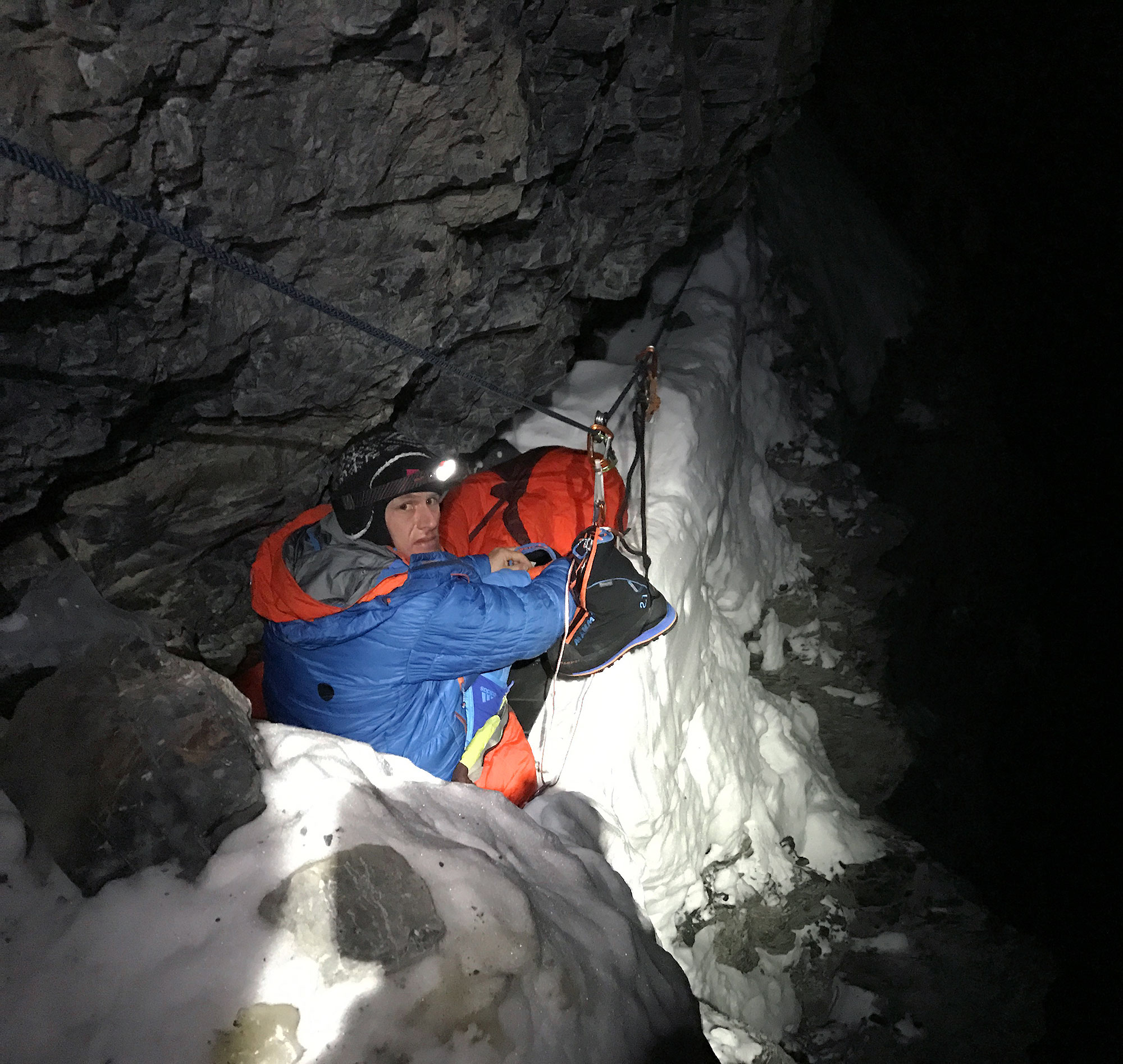 Stephan Siegrist trying to grab some sleep during a frigid night at the “Eagle’s Nest” bivy. Photo © Thomas Huber/Roger Schaeli/Stephan Siegrist