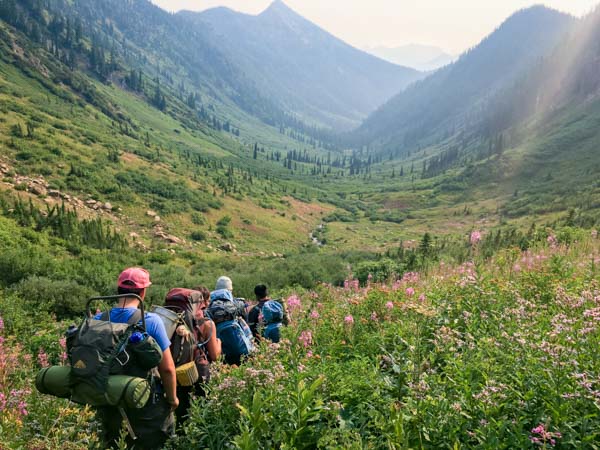 VISIONS participants backpacking in the rugged Montana backcountry. Photo credit Matthew Dayton. Image NOT generated by AI