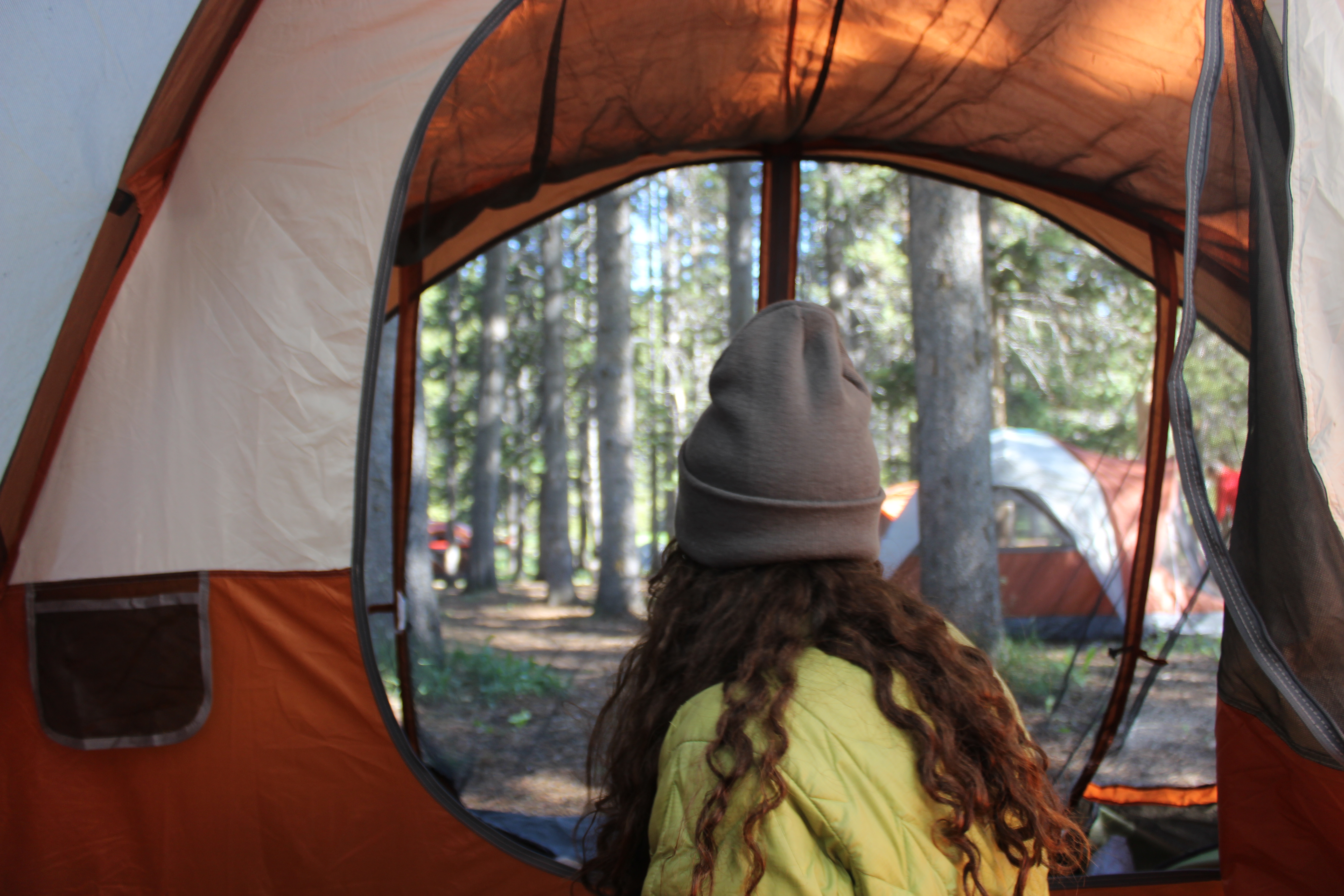 VISIONS students camping in the Montana wilderness. CREDIT: Emma Crosswait. Image NOT generated by AI