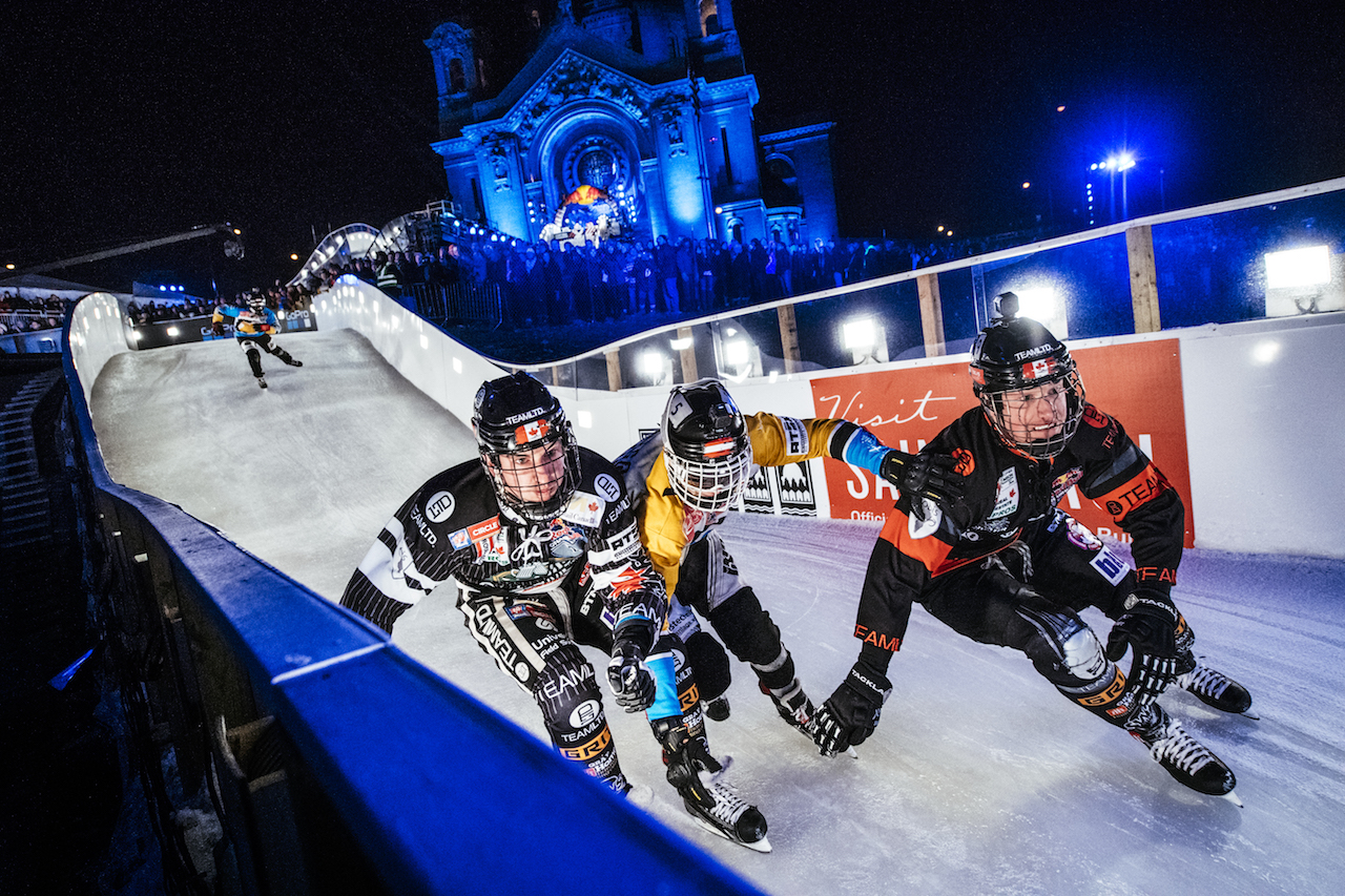Scott Croxall of Canada, Kyle Croxall of Canada, Marco Dallago of Austria and Luca Dallago of Austria compete during the finals at the third stage of the ATSX Ice Cross Downhill World Championship at the Red Bull Crashed Ice in Saint Paul, Minnesota, United States on February 4, 2017.