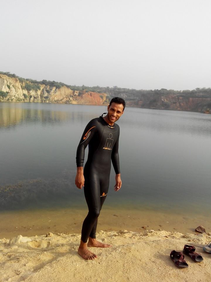 Saurabh posing in front of a lake in Faridabad