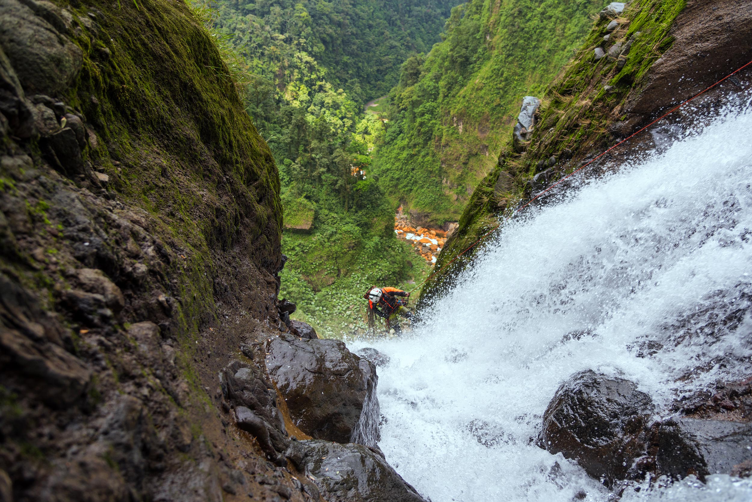 Daniel rappels off the edge of the 400 ft. monster waterfall. Photo: Victor Hugo Carvajal 